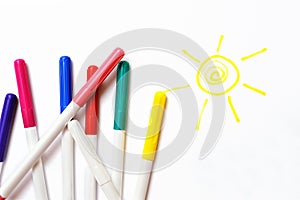 Colour felt-tip pens and sun