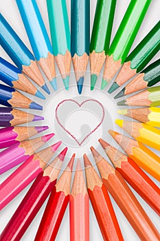 Colour pencils displayed in love heart photo