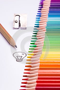 Colour pencils showing the full colour spectrum in a straight line revealing a symbol of creativity