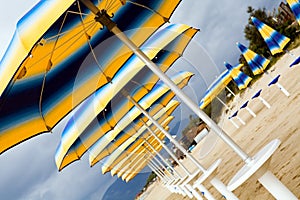 Colour sunshades on a empty beach