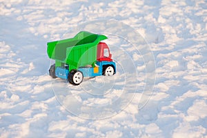 Colour toy truck on the snow