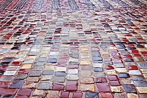 Colour wet cobblestone road in rainy weather