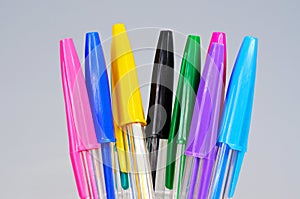 Coloured ballpoint pens.