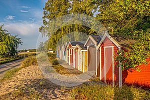 Coloured beach huts in a row