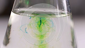 Coloured beautiful chemical reaction in flask.