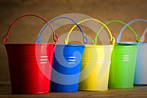 Coloured buckets on the floor