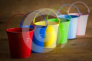 Coloured buckets on the floor