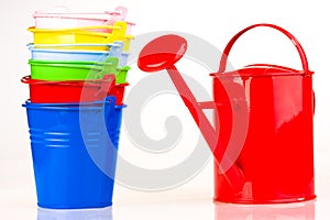 Coloured buckets and watering can