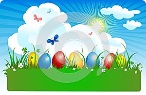 Coloured eggs in a meadow