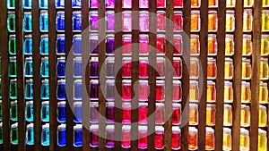 Coloured glass pots in a wall