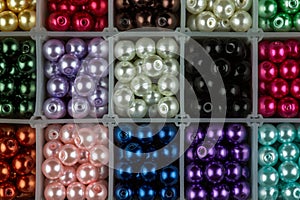 Coloured Jewellery Beads in a Plastic Partitioned Container