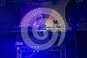 Coloured laser disco light on a stage set