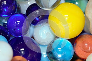 Coloured marbles close together - stock photo