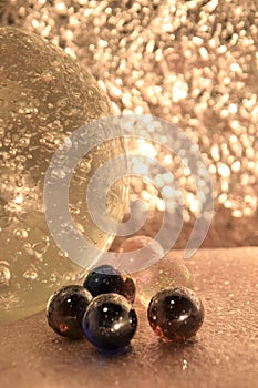 Abstract picutre with coloured marbles and crystal bubble glass ball, bokeh