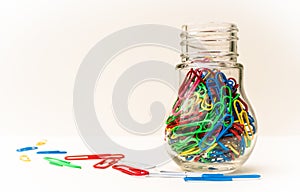 Coloured Paper Clips in a Container