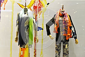 Coloured and patterned scarves in shop window
