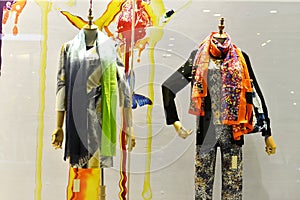 Coloured and patterned scarves in shop window photo