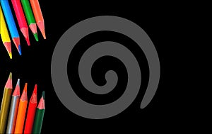 Coloured pencils on black background