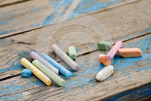 Coloured pieces of chalk on the board