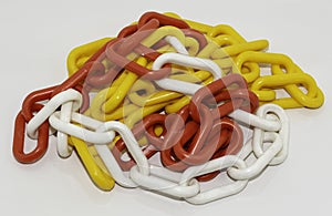 A coloured plastic chain,  on white.