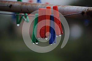 Coloured plastic pegs on a washing line