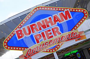 Coloured sign for amusements on pier