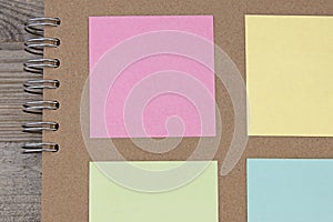 Coloured square paper on brown paper scrapbook