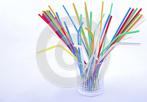Coloured straw at glass