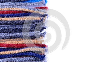 Coloured woolen threads on a white background