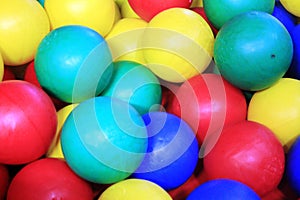 Closeup photo with colorful balls for kids - green, yellow, red and blue