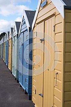 Colourful beach huts located on the promenade on the Bournemouth UK sea front.