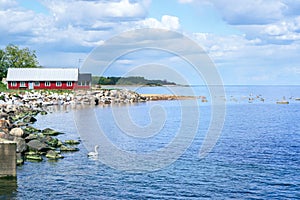 Colourful beach huts in a row on the beach in Simrishamn, Skane, Sweden