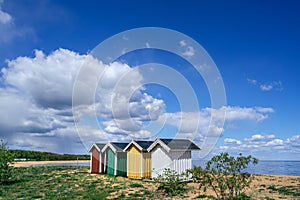 Colourful beach huts in a row on the beach in Simrishamn, Skane, Sweden