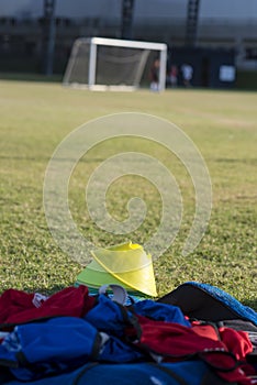 Colourful bibs left on a football pitch, ready for the next training session to come. photo