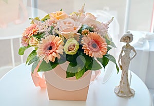 Colourful bouquet of gently flowers in hat box