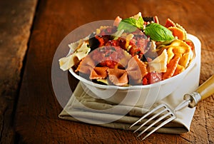 Colourful bow tie pasta with tomato