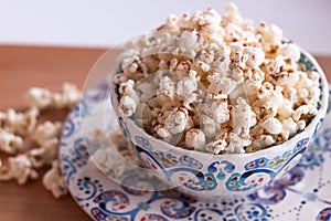 Colourful Bowl of Popcorn sprinkled with cinnamon