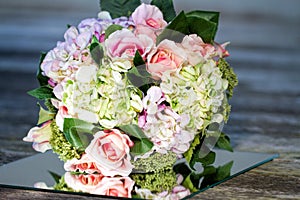 Bridal Bouquet On Mirror Tile In Rustic Setting