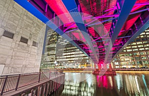 Colourful bridge at night in Canary Wharf, London
