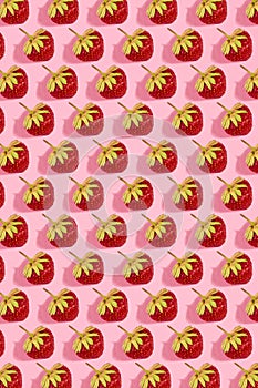 Colourful bright pattern with ripe strawberry. Top view. Pink background