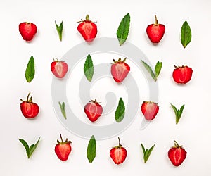 Colourful bright pattern of strawberries and mint leaves. Flat lay on white background