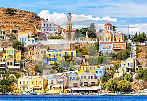 Colourful buildings and Church on a beautiful summers day at Symi Town Greece Europe