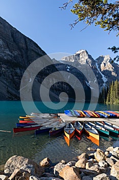 Colourful canoes on the scenic and popular Lake Moraine, Alberta, Canada