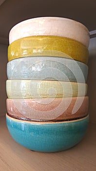 Colourful ceramic bowl in kitchen cabinet