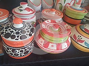 Colourful ceramic pots displayed in Indian handicraft exhibition shop Indian pottery