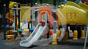 a colourful children playground equipment play ground in park.