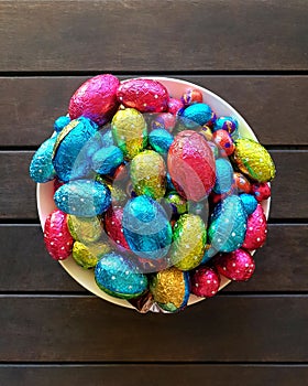 colourful chocolate Easter eggs in bowl  on table
