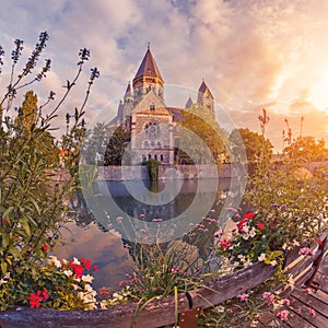 colourful city view of an ancient Neuf Church on the bank of the Moselle river in Metz in France during the sunrise. Tourist