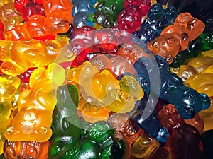A colourful close up of a pile of big gummy bear candies