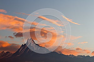 Colourful clouds at sunrise over Machapuchare